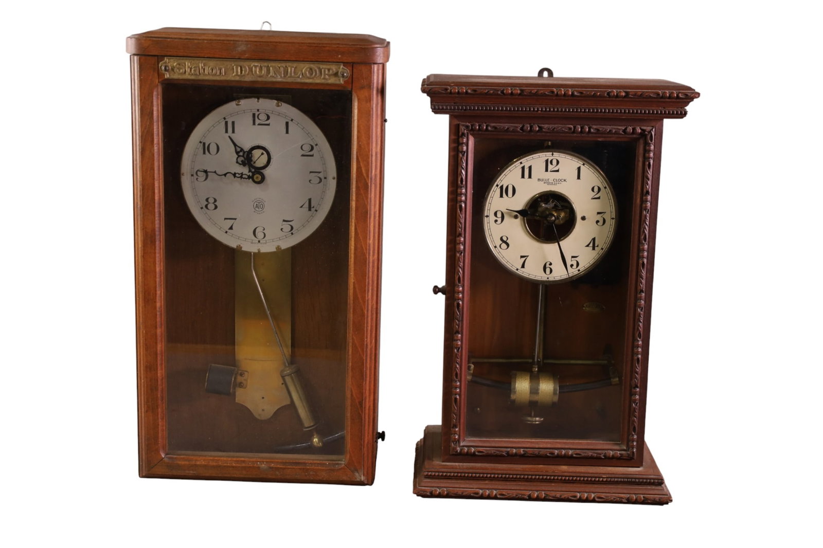 2 CLOCKS: BULLE MAHOGANY CASE WALL CLOCK & ELECTRIQUE FRENCH DUNLOP STATION CLOCK. 10" x 18" ALL CLOCKS ARE SOLD AS IS WE DO NOT GUARANTEE WORKING ORDER.