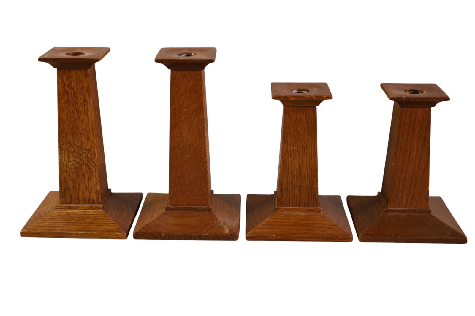 SET OF 4 STICKLEY CANDLESTICKS: 2 PAIRS OF STICKLEY ARTS & CRAFTS CANDLESTICKS. 8" H & 6" H.