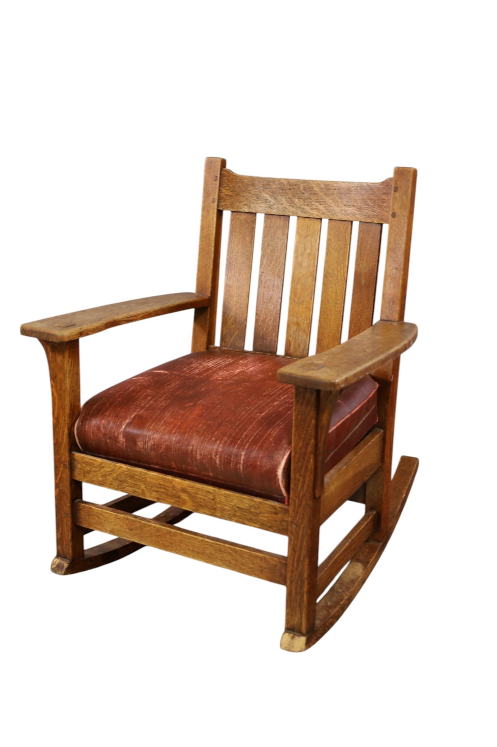 L.J.&G STICKLEY ROCKER: OAK ARTS & CRAFTS ROCKER, MARKED L.J.&G STICKLEY. WEAR TO FINISH, SCRATCHES. 27" W x 23" D x 32" H. THIS ITEM EXCEEDS SIZE, WEIGHT, AND OR FRAGILITY LIMITATIONS FOR IN HOUSE SHIPPING, MUST BE PICKED