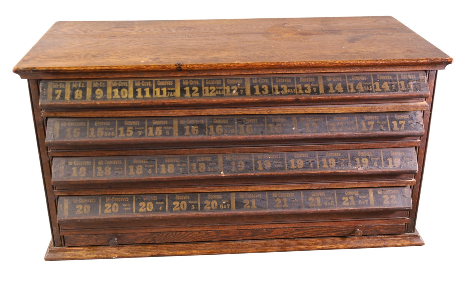 WATCH MAKERS CABINET: 4 DRAWER OAK WATCH MAKERS CABINET WITH WATCH CRYSTALS. 27" W x 12" D x 14" H. THIS ITEM EXCEEDS SIZE, WEIGHT, AND OR FRAGILITY LIMITATIONS FOR IN HOUSE SHIPPING, MUST BE PICKED UP IN HOUSE OR SHIPPED