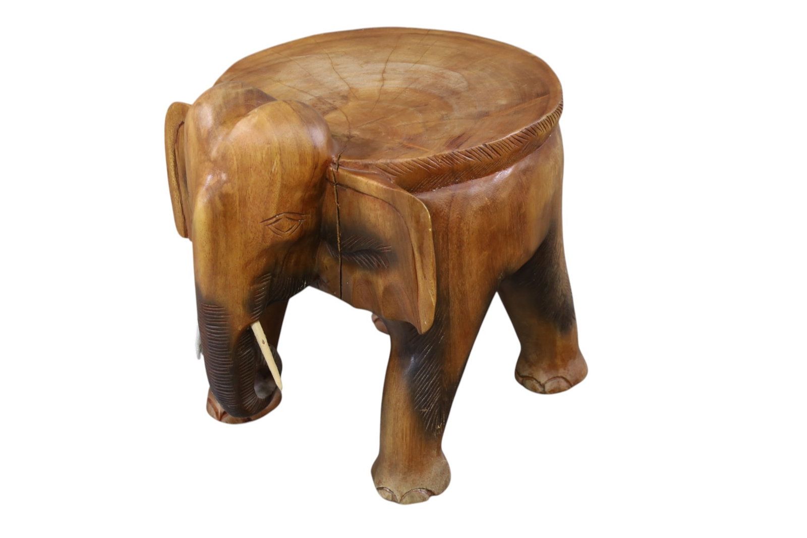 ELEPHANT STOOL: HARDWOOD ELEPHANT STOOL. 14" DIAM. 15" H. THIS ITEM EXCEEDS SIZE, WEIGHT, AND OR FRAGILITY LIMITATIONS FOR IN HOUSE SHIPPING, MUST BE PICKED UP IN HOUSE OR SHIPPED VIA 3RD PARTY SHIPPER.