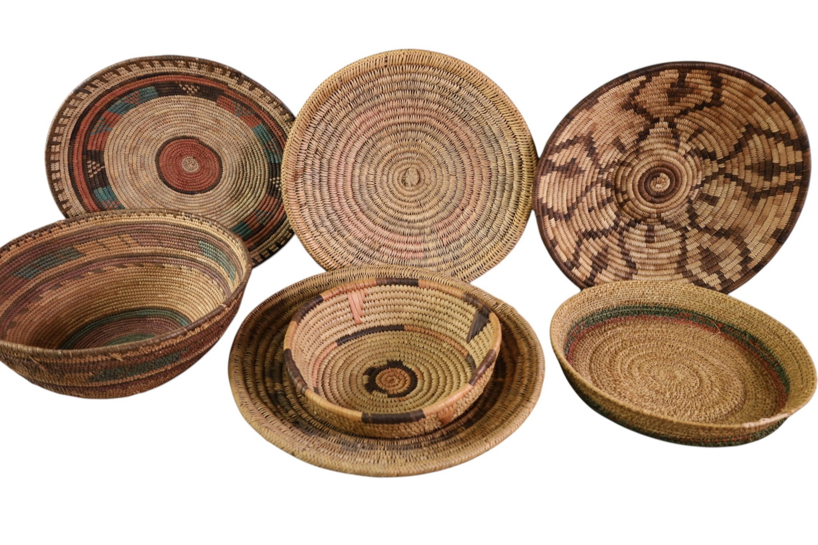 GROUPING OF BASKETS: 7 NATIVE AMERICAN STYLE BASKETS, 12" - 14" DIAM.