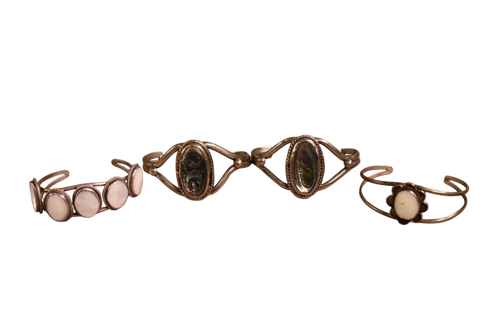 4 NAVAJO BRACELETS: 2 SILVER WITH MOTHER OF PEARL & 2 SHELL.