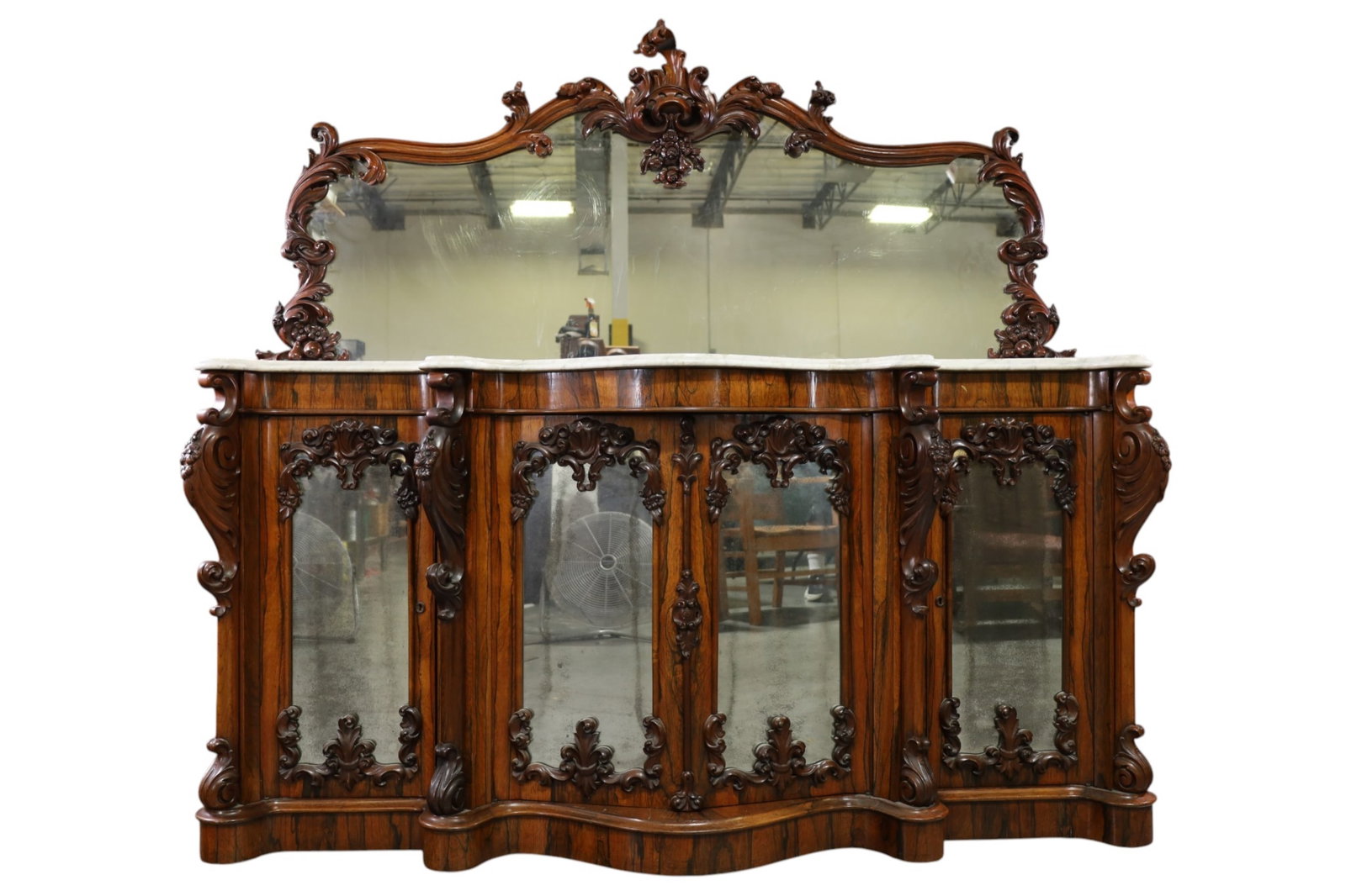 LARGE VICTORIAN MARBLE TOP BUFFET: HIGHLY CARVED VICTORIAN ROSEWOOD MARBLE TOP BUFFET, MIRRORED BACK. CRACKS TO MARBLE. 74" W x 23" D x 68 1/2" H. THIS ITEM EXCEEDS SIZE, WEIGHT, AND OR FRAGILITY LIMITATIONS FOR IN HOUSE SHIPPING,