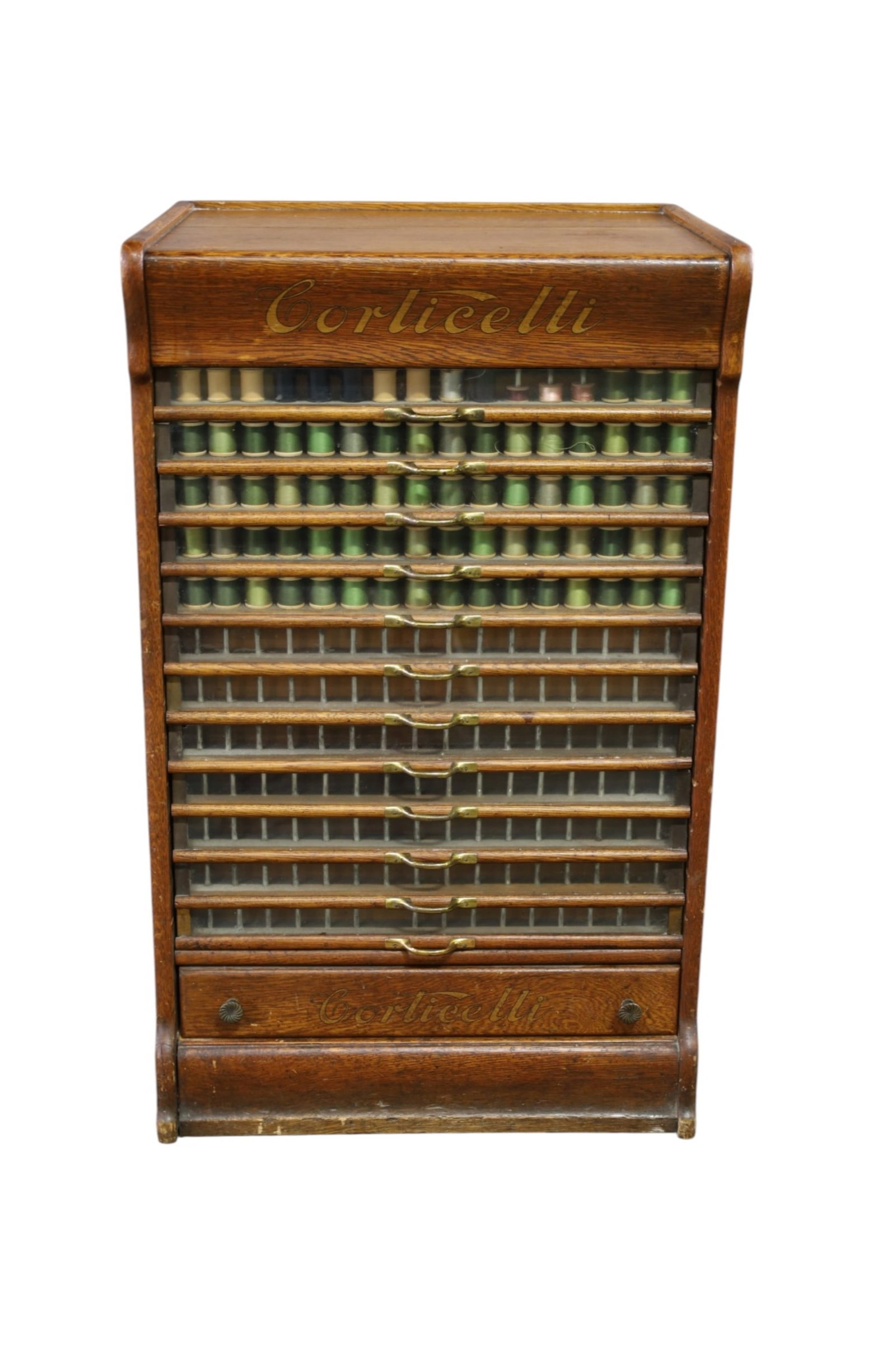 CORTICELLI SPOOL CABINET: LARGE OAK CORTICELLI SPOOL CABINET, 12 DRAWER SPOOL CABINET, WEAR TO FINISH. SCRATCHES. 21" W x 17" D x 34" H. THIS ITEM EXCEEDS SIZE, WEIGHT, AND/OR FRAGILITY LIMITATIONS FOR IN HOUSE SHIPPING, MUST