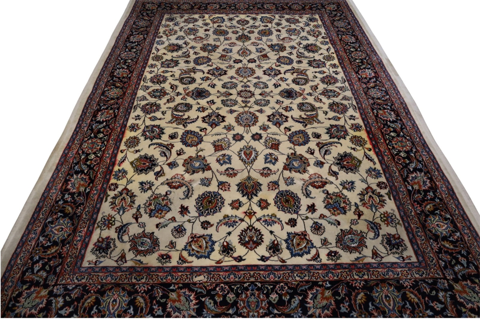 APPROX 6' 9" x 9' 10" HANDMADE WOOL RUG: WOOL AND SILK PILE, NEEDS CLEANED. BLEEDING