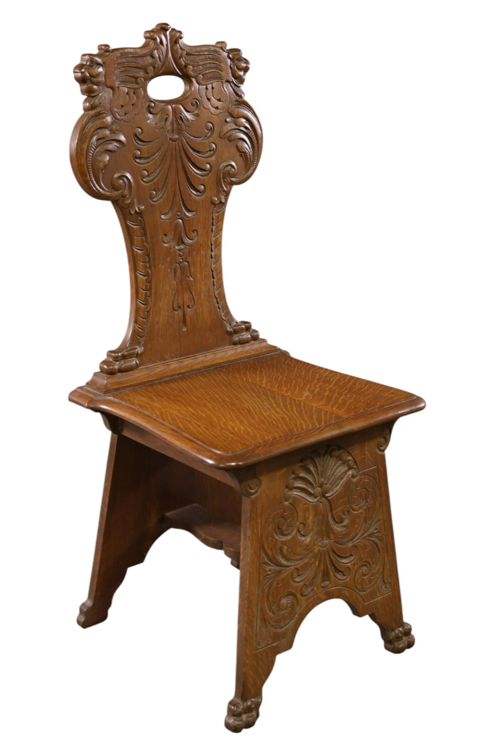OAK SGABELLO STYLE HALL CHAIR: CARVED OAK SGABELLO STYLE HALL CHAIR, AGE SPLIT. 18" W x 16" D x 41" H. THIS ITEM EXCEEDS SIZE, WEIGHT, AND/OR FRAGILITY LIMITATIONS FOR IN HOUSE SHIPPING, MUST BE PICKED UP IN HOUSE OR SHIPPED VIA