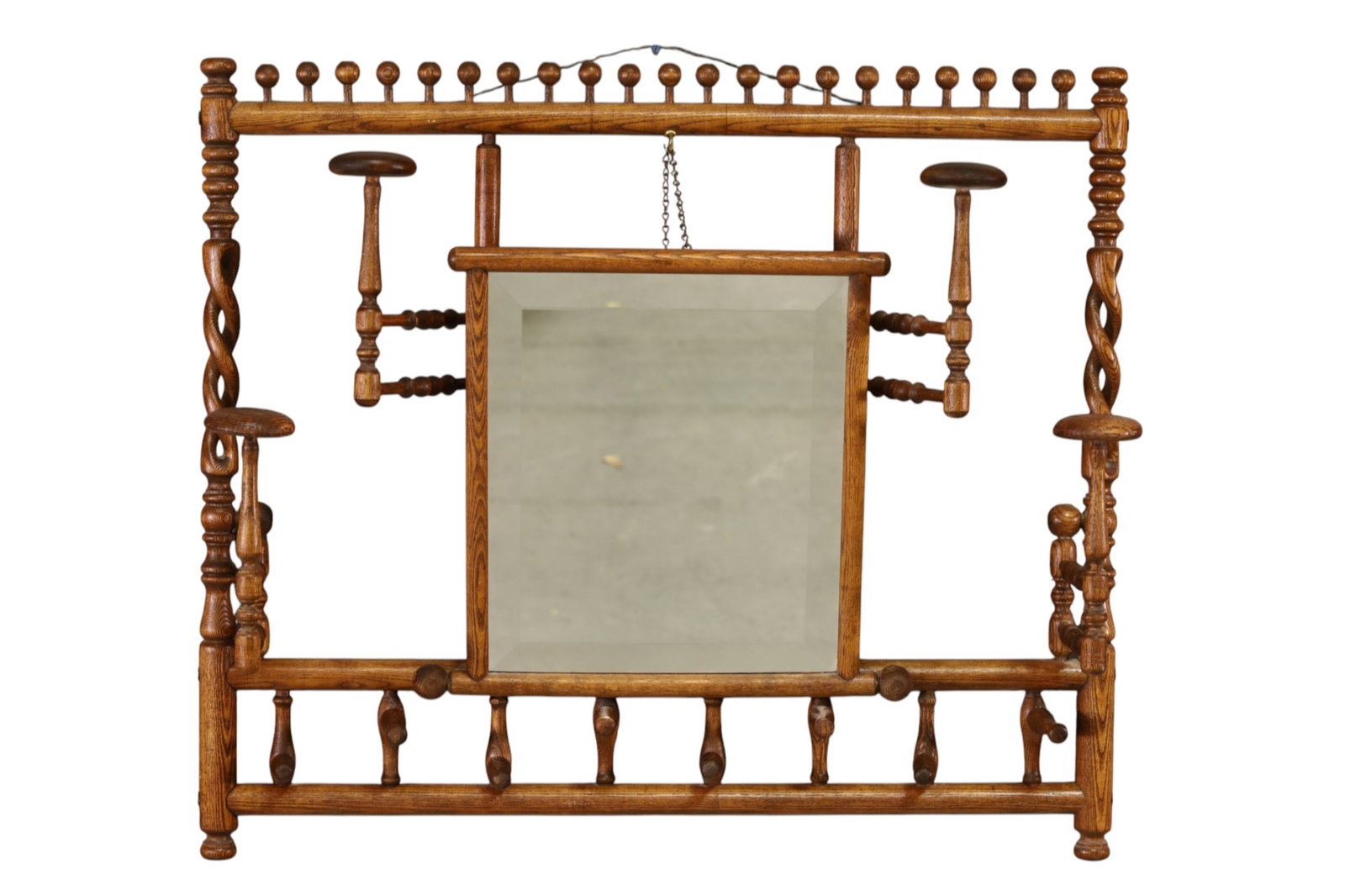 STICK AND BALL HANGING RACK: OAK STICK AND BALL HANGING RACK, WITH BEVELED MIRROR IN CENTER. 31" W x 27" H. THIS ITEM EXCEEDS SIZE, WEIGHT, AND/OR FRAGILITY LIMITATIONS FOR IN HOUSE SHIPPING, MUST BE PICKED UP IN HOUSE OR