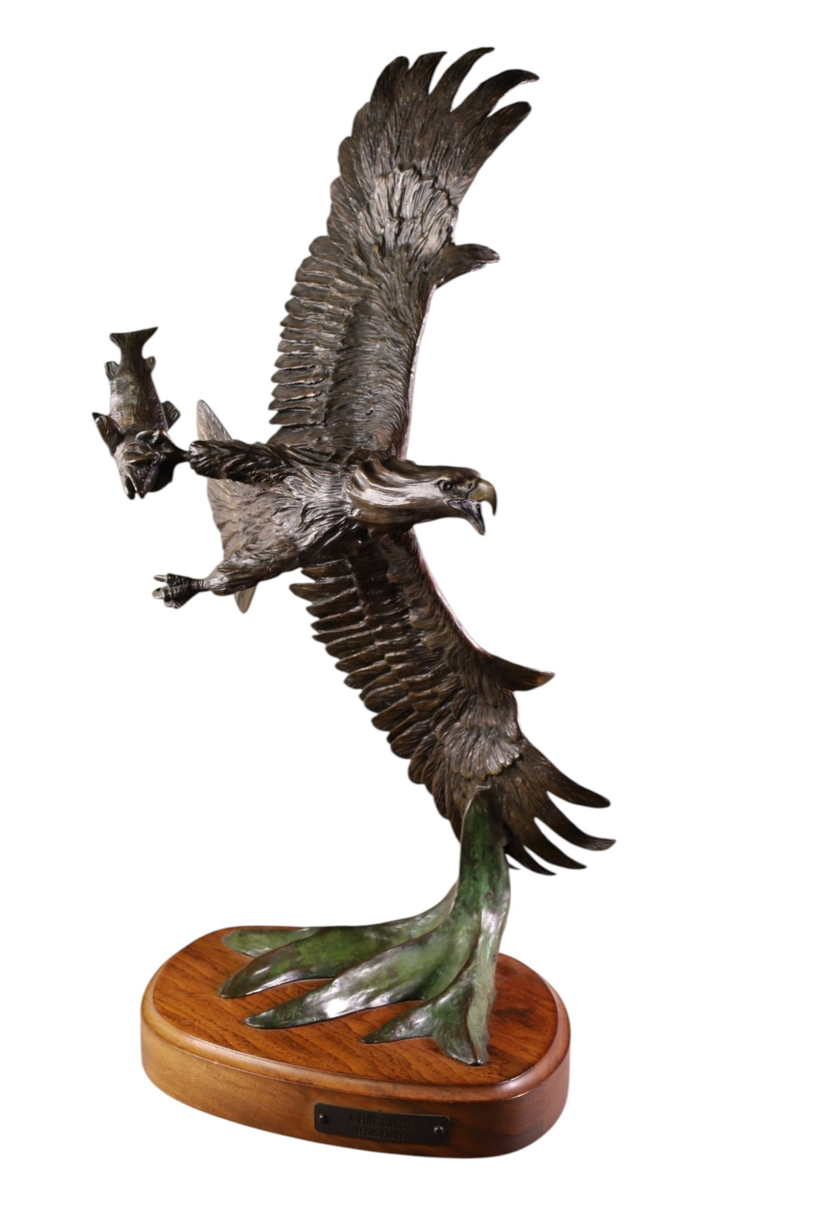LARGE CARL WAGNER BRONZE SCULPTURE: LARGE BRONZE EAGLE SCULPTURE, ON WOODEN BASE, TITLED FINE CATCH, No 5/50. WITH CERTIFICATE. 29" H.