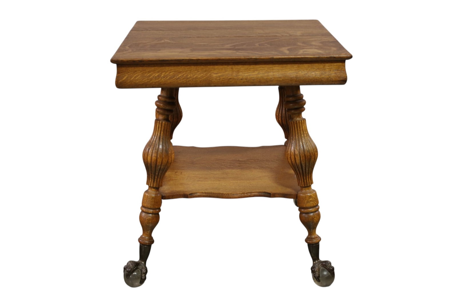 OAK LAMP TABLE: AMERICAN OAK TWO TIER LAMP TABLE, BALL AND CLAW FOOT. MINOR WEAR TO FINISH. 28" x 28" x 31" H. THIS ITEM EXCEEDS SIZE, WEIGHT, AND/OR FRAGILITY LIMITATIONS FOR IN HOUSE SHIPPING, MUST BE PICKED UP IN