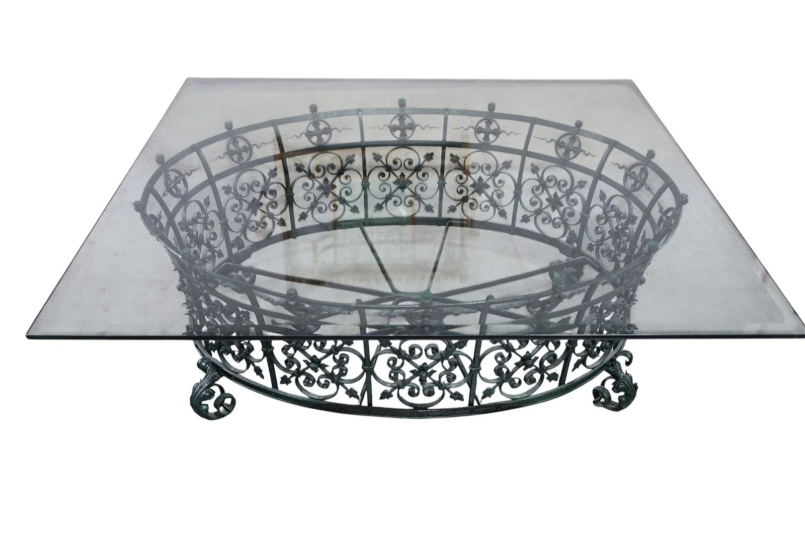 IRON BASE COFFEE TABLE: LARGE ORNATE IRON BASE COFFEE TABLE, GLASS TOP. 46" x 46" x 16 1/2" H. THIS ITEM EXCEEDS SIZE, WEIGHT, AND/OR FRAGILITY LIMITATIONS FOR IN HOUSE SHIPPING, MUST BE PICKED UP IN HOUSE OR SHIPPED VIA