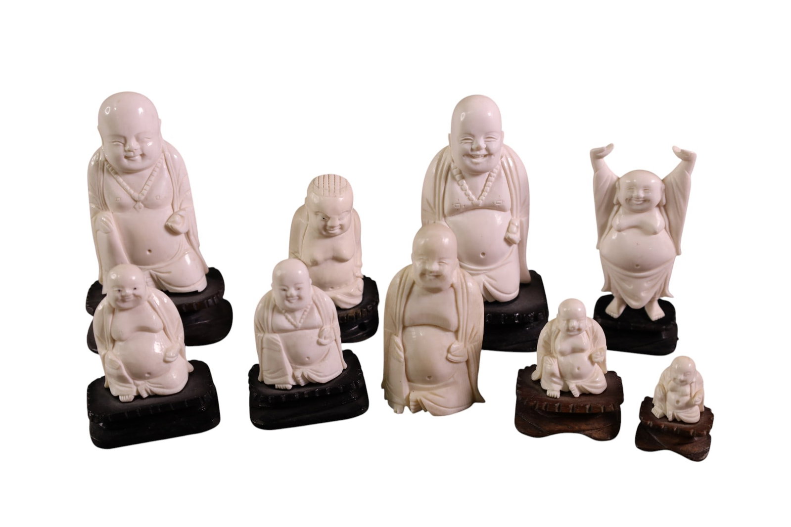 9 BUDDHA FIGURES: CARVED BONE CHINESE BUDDHA FIGURES, ON WOODEN BASES.