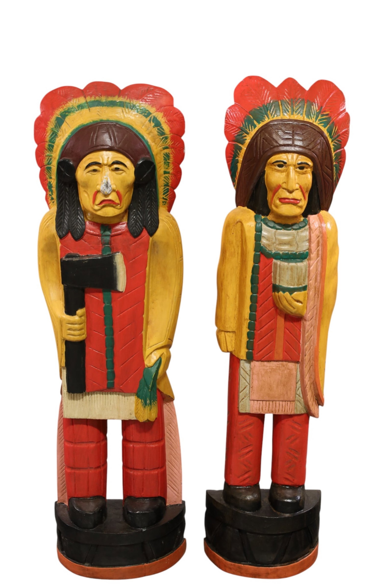 PAIR OF CIGAR STORE INDIANS: PAIR OF CARVED WOOD CIGAR STORE INDIANS, PAINTED FINISH. CONTEMPORARY. PAINT LOSS. 39" H. THIS ITEM EXCEEDS SIZE, WEIGHT, AND/OR FRAGILITY LIMITATIONS FOR IN HOUSE SHIPPING, MUST BE PICKED UP IN