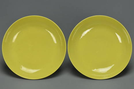 A PAIR OF QING DYNASTY DISHES QIANLONG MARK: A Pair of Qing Dynasty Lemon-Yellow Dishes Qianlong Mark. Dimensions: 4 3/4 x 1 in. Provenance: From the collection of Charles George(1898-1983). Manager of Sir Victor Sassoon's Empire in China, Mr