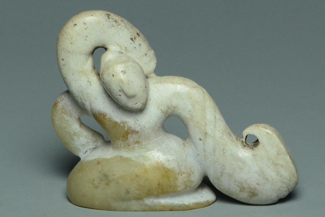 A HAN DYNASTY CALCIFIED JADE FIGURE OF A DANCER (1 of 15)