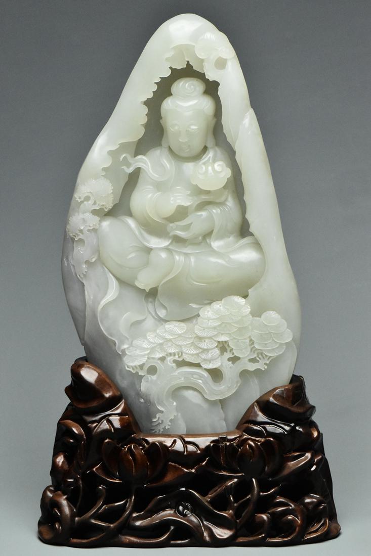 A QING DYNASTY WHITE JADE GUANYIN BOULDER & STAND (1 of 17)