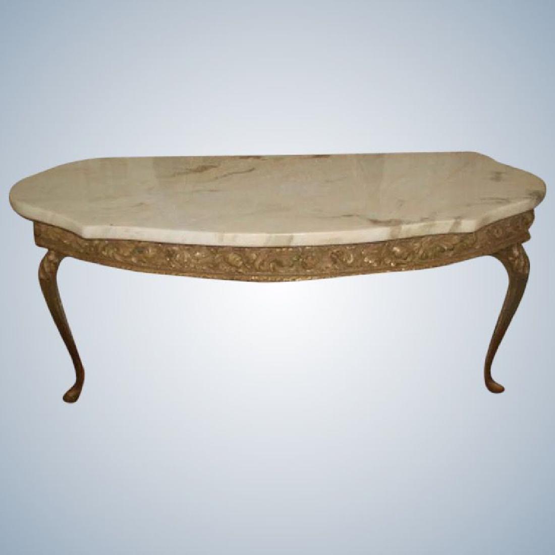Italian Console Table Marble Top Gilt Early 1900's: Early 1900's Italian console table with attached marble top in antique cream background and camel and light brown veining with a hint of pink in some veins. Ornate gilt wood apron depicts acanthus lea