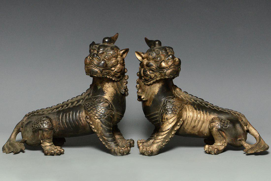 A PAIR OF GILT-LACQUERED BRONZE MYTHICAL BEAST (1 of 10)
