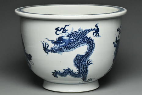 A BLUE AND WHITE DRAGON JARDINIERE: A BLUE AND WHITE DRAGON JARDINIERE. Dimensions: 9 x 6 1/2 in. High resolution pictures can be found at https://file.ac/hp57HDyNQdY/