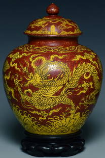 A DRAGON JAR JIAJING MARK AND PERIOD AND STAND: A MING DYNASTY DRAGON JAR JIAJING MARK AND PERIOD AND STAND. Dimensions: 9 x 7 in. Provenance: From the collection of Charles George(1898-1983). Manager of Sir Victor Sassoon's Empire in China, Mr