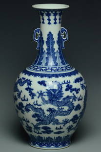 A DRAGON VASE QIANLONG MARK AND PERIOD: A BLUE AND WHITE DRAGON VASE QIANLONG MARK AND PERIOD. Dimensions: 11 1/2 x 6 1/4 in. Provenance: From the collection of Charles George(1898-1983). Manager of Sir Victor Sassoon's Empire in China, Mr