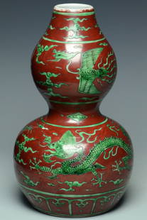 DRAGON DOUBLE GOURD VASE JIAJING MARK AND PERIOD: A MING DYNASTY DRAGON DOUBLE GOURD VASE JIAJING MARK AND PERIOD. Dimensions: 8 3/4 x 5 in. Provenance: From the collection of Charles George(1898-1983). Manager of Sir Victor Sassoon's Empire in China