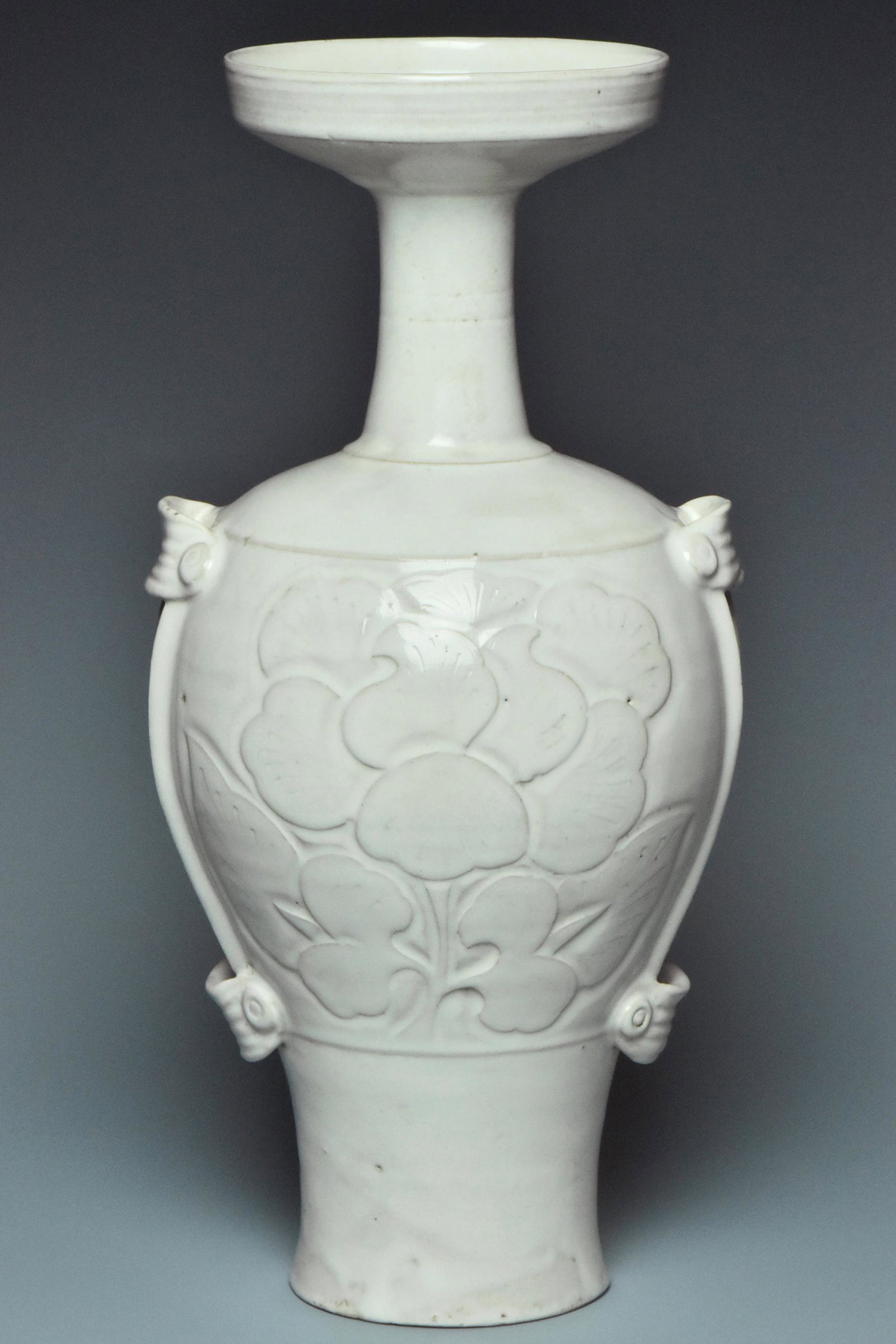 A LIAO DYNASTY WHITE GLAZED FLORAL VASE: A LIAO DYNASTY WHITE GLAZED FLORAL VASE. Dimensions: 14 x 6 3/4 x 6 1/2 in. Provenance: From the collection of Charles George(1898-1983). Manager of Sir Victor Sassoon's Empire in China, Mr Charles Ge
