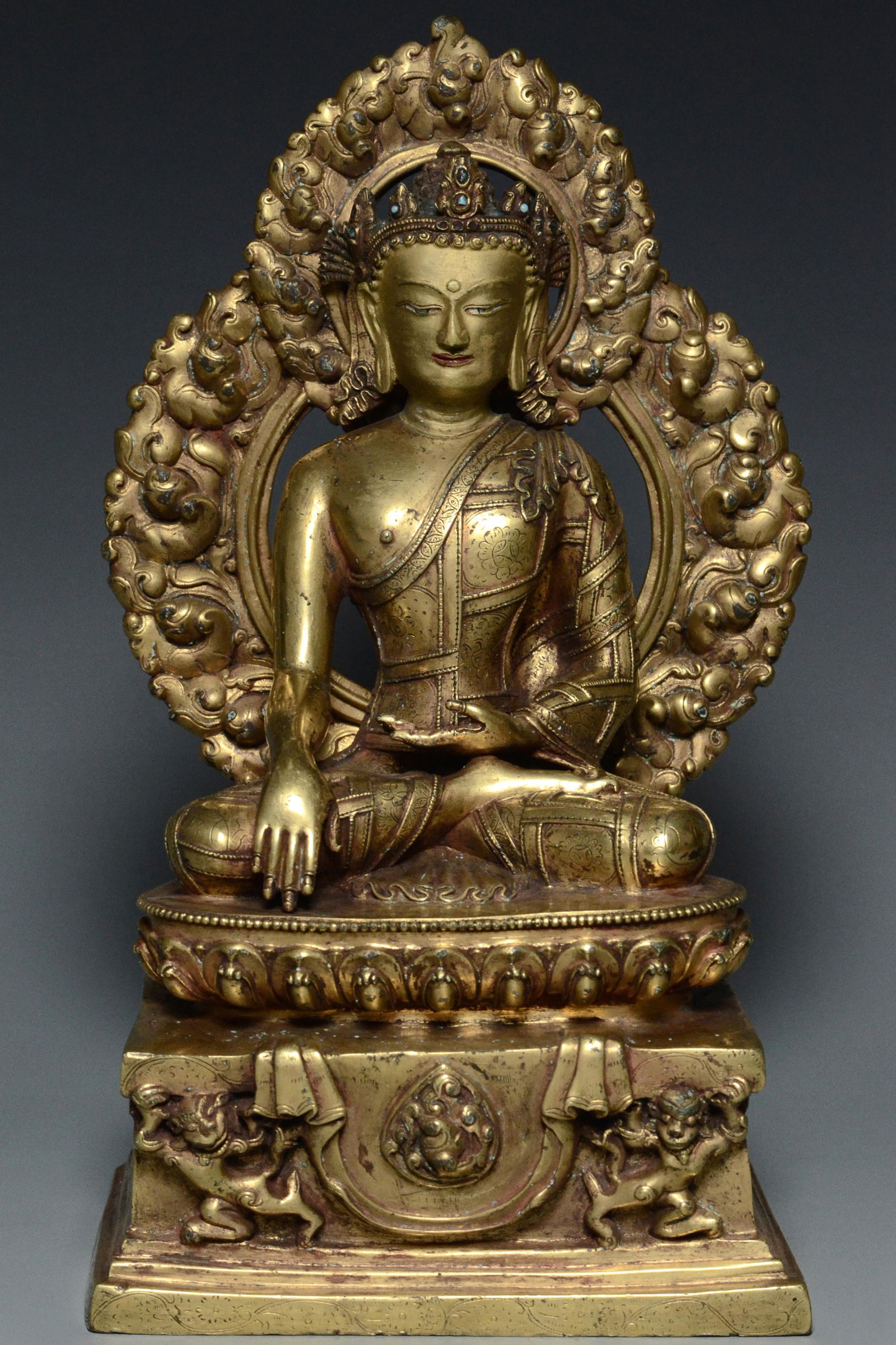 A MING DYNASTY GILT BRONZE FIGURE OF BUDDHA (1 of 14)