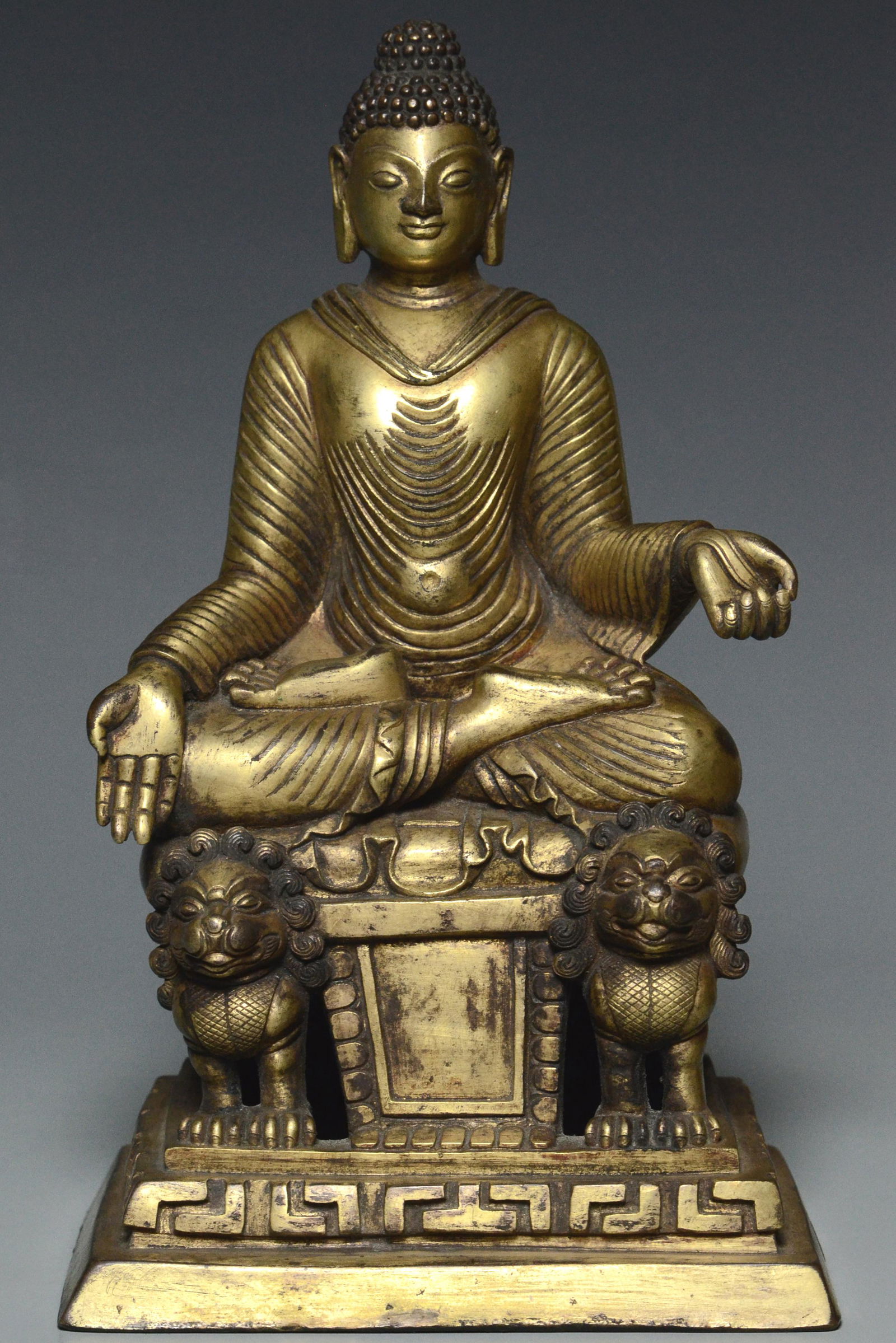 A YUAN DYNASTY GILT BRONZE FIGURE OF BUDDHA (1 of 14)
