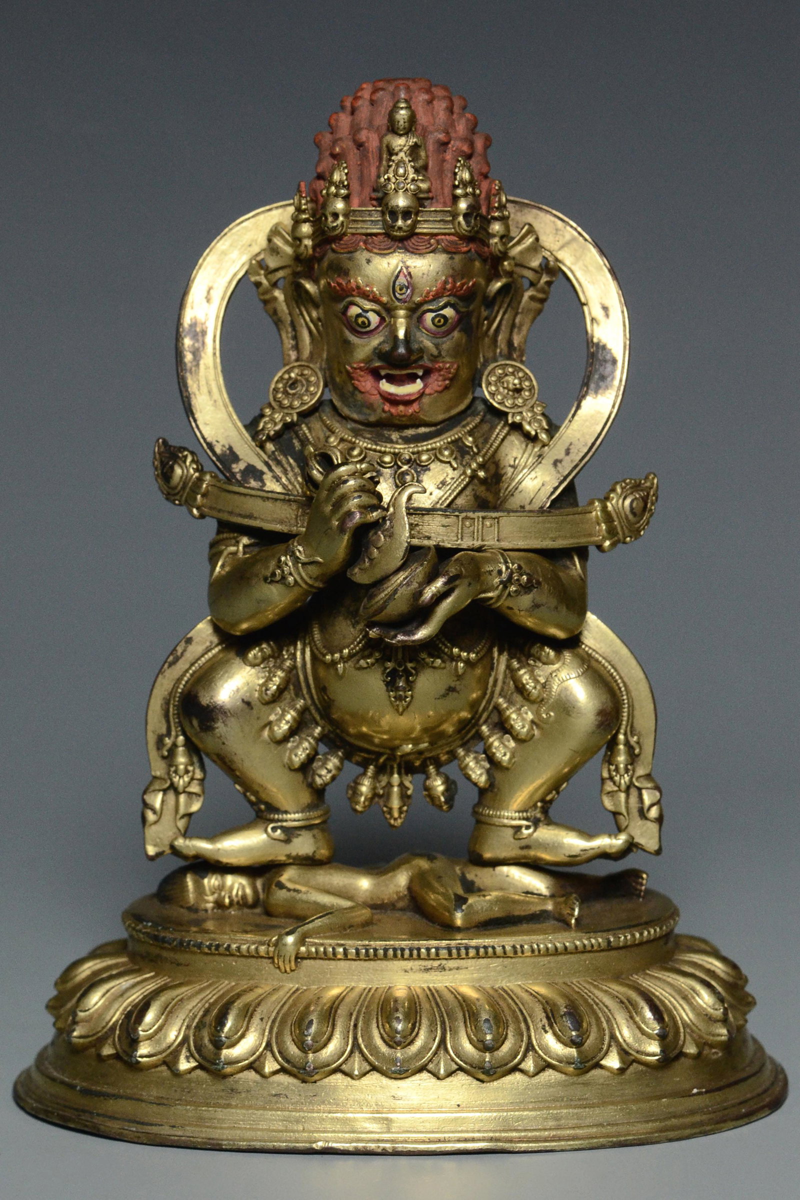 AN INSCRIBED MING DYNASTY GILT BRONZE MAHAKALA: AN INSCRIBED MING DYNASTY GILT BRONZE MAHAKALA . Dimensions: 5 1/2 x 4 1/4 x 2 3/4 in. Provenance: The vendors relative was one Mr Robin George who was trained as a lawyer in Australia and went to the