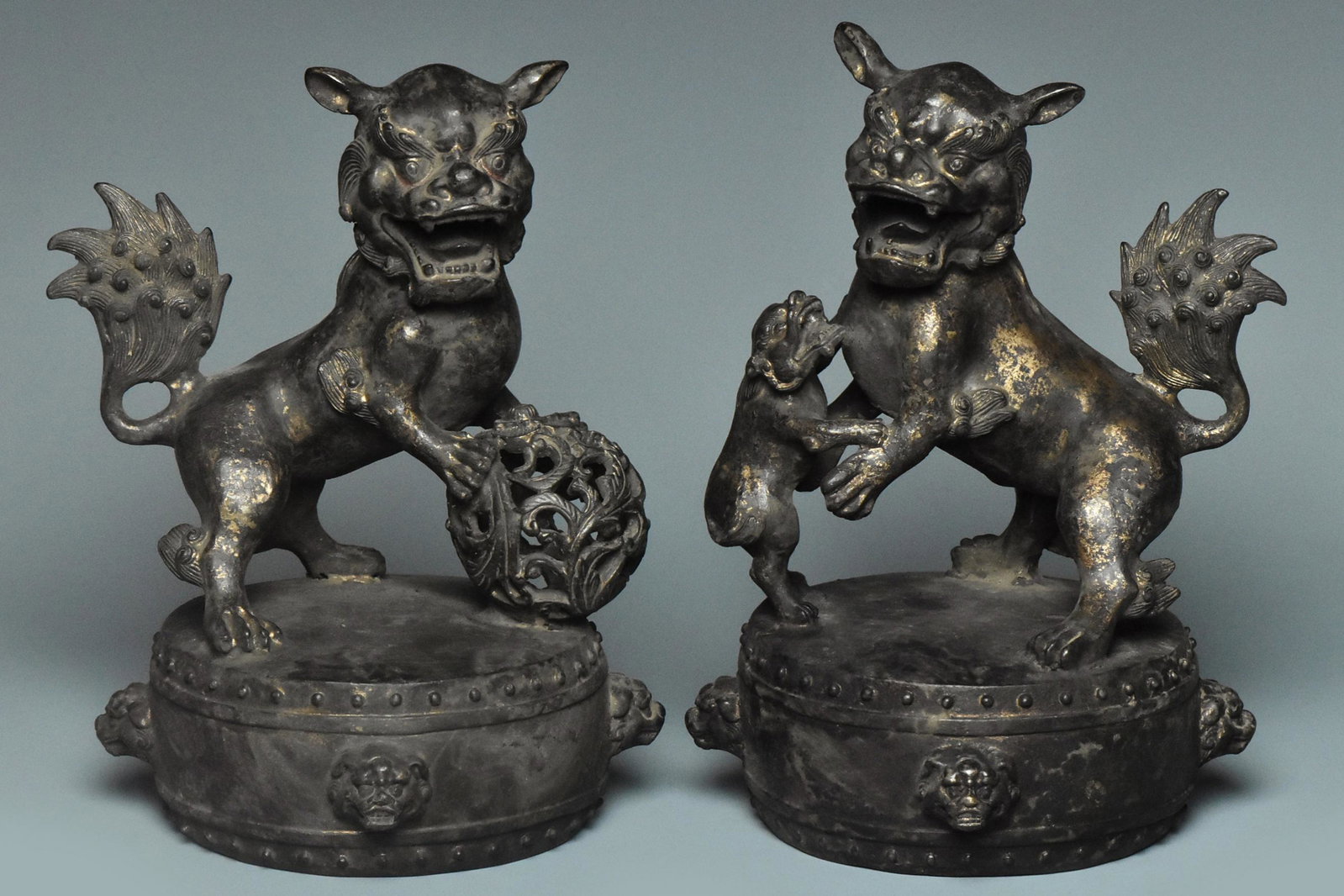 A PAIR OF BRONZE BUDDHIST LION QIANLONG MARK: A PAIR OF GILT-LACQUERED BRONZE BUDDHIST LION QIANLONG MARK. Dimensions: 8 3/4 x 6 1/4 x 6 1/4 in. High resolution pictures can be found at https://file.ac/aDhPgBd61so/