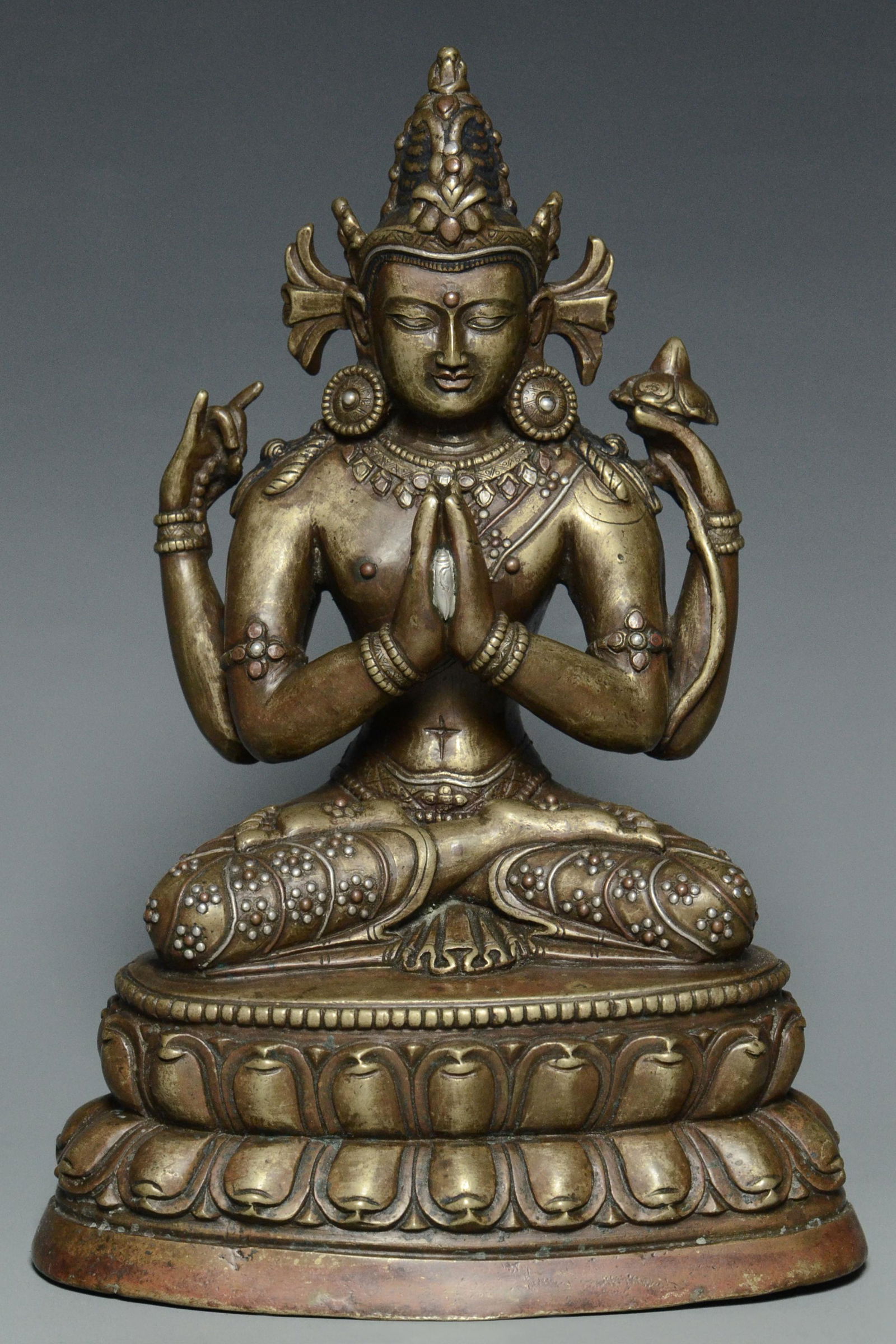 A YUAN DYNASTY SILVER-INLAID BRONZE SADAKSHARI (1 of 15)