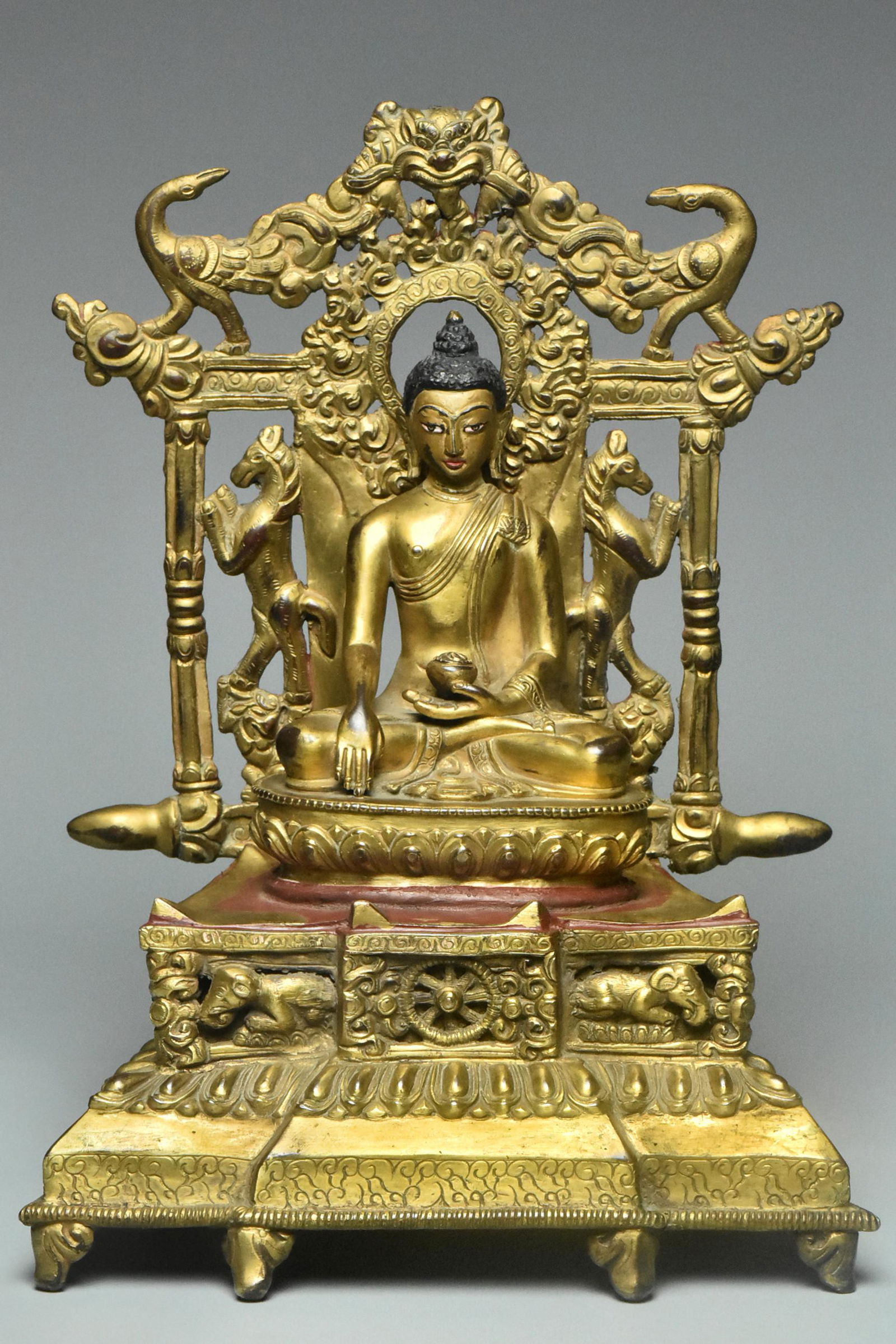 A YUAN DYNASTY GILT BRONZE FIGURE OF BUDDHA (1 of 15)