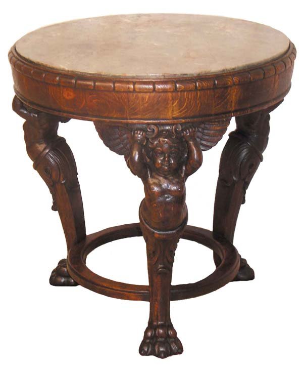 Carved oak center table w/ standing puttis