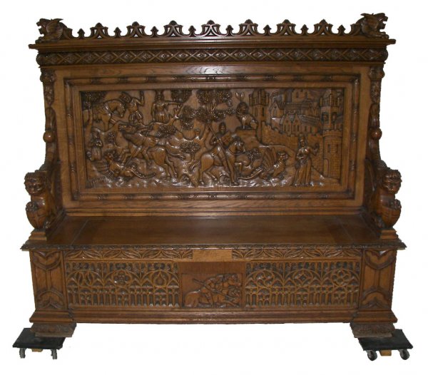 Gothic carved oak lift top bench with lions and shi