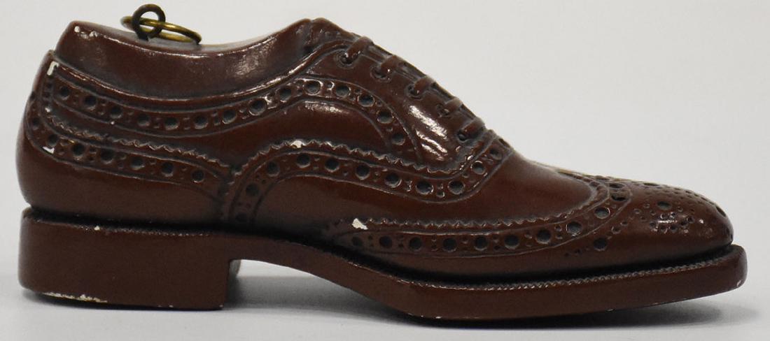 the Florsheim shoe advertising 5" shoe: the Florsheim shoe advertising 5" shoe Measures Apx. 2" tall and 1" wide. Condition reports are provided upon request.