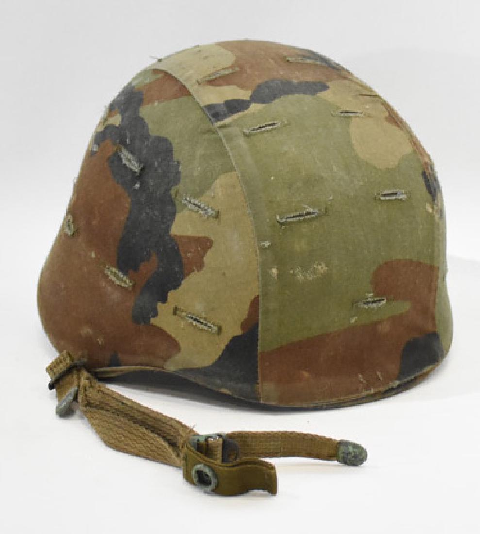 Military helmet: Military helmet Measures Apx. 8" tall and 9" wide. Condition reports are provided upon request.