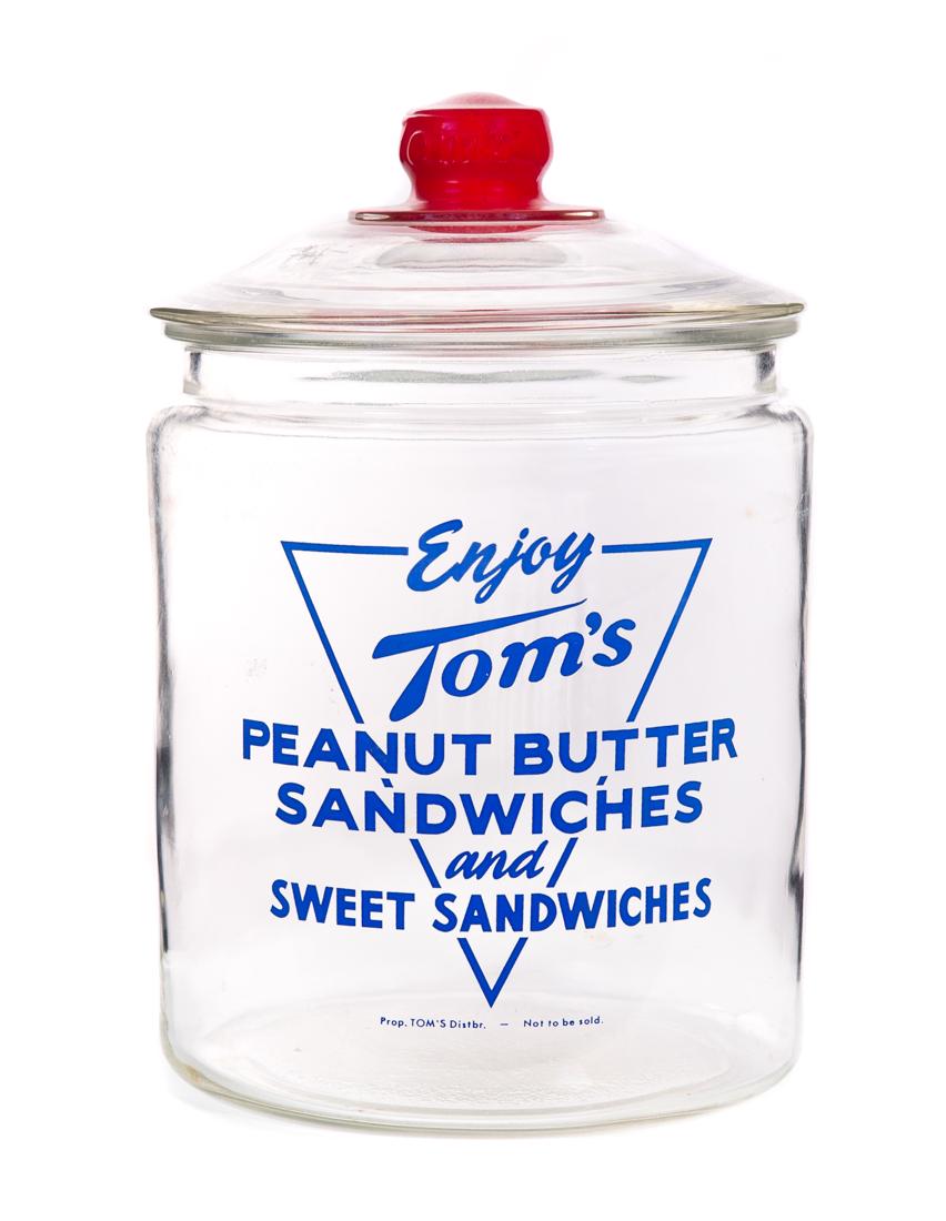 Toms Peanut Butter Sandwich Glass Display Jar: Measures 7" tall, 8" wide. Good original condition. Please Email or call for a detailed condition report. The absence of a condition statement does not imply that the lot is in perfect condition or co
