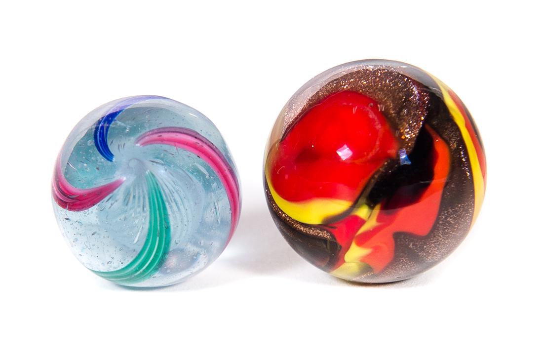 2 Handmade Marbles .93" German Swirl and 1.07": Measures .93" and 1.07". Good original condition. Please Email or call for a detailed condition report. The absence of a condition statement does not imply that the lot is in perfect condition or comp
