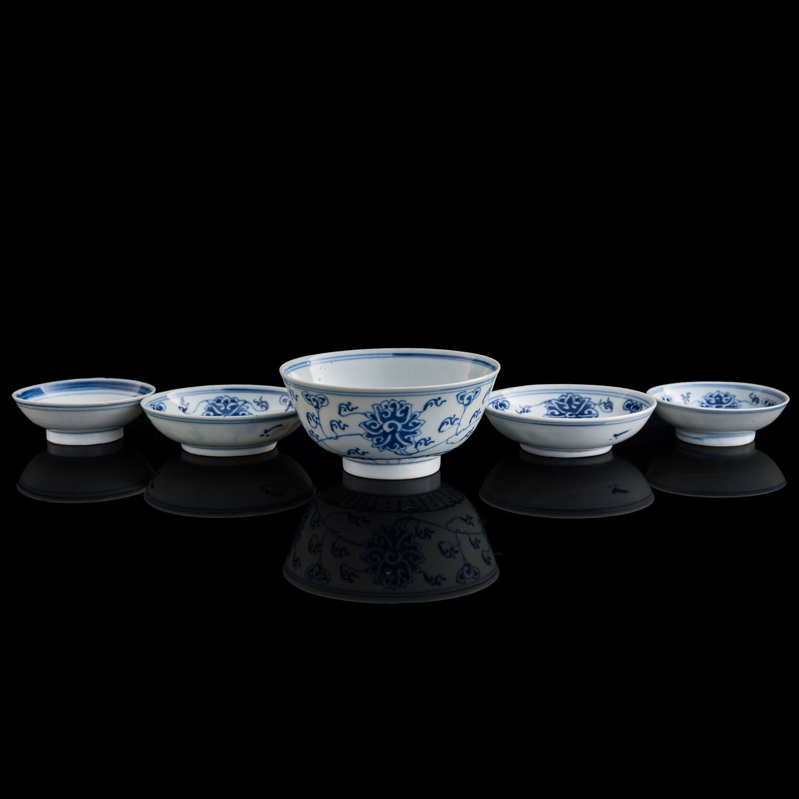 Chinese blue and white dishes and a bowl, late 19th century: Size: H: 2 1/8, Dia: 4 5/8 in. (largest). Description: Four Chinese blue and white dishes and a bowl. late 19th century. Three with four-character mark to underside and two with six-character mark to