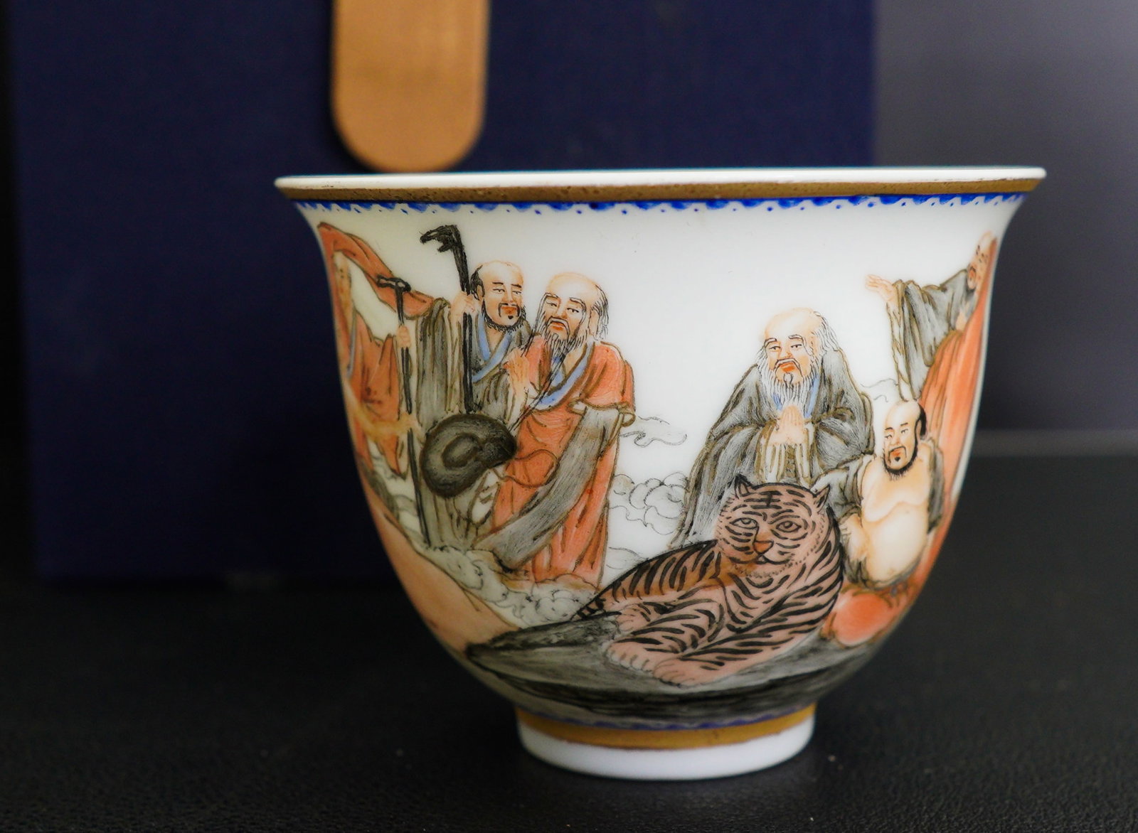A CHINESE SEMI-EGGSHELL ENAMELLED 'FIGURAL' CUP: Size: 3" x 3" x 2". Description: A CHINESE SEMI-EGGSHELL ENAMELLED 'FIGURAL' CUP Republic Period, Qianlong mark. Thinly potted with deep rounded sides rising from a short foot to an everted rim, the