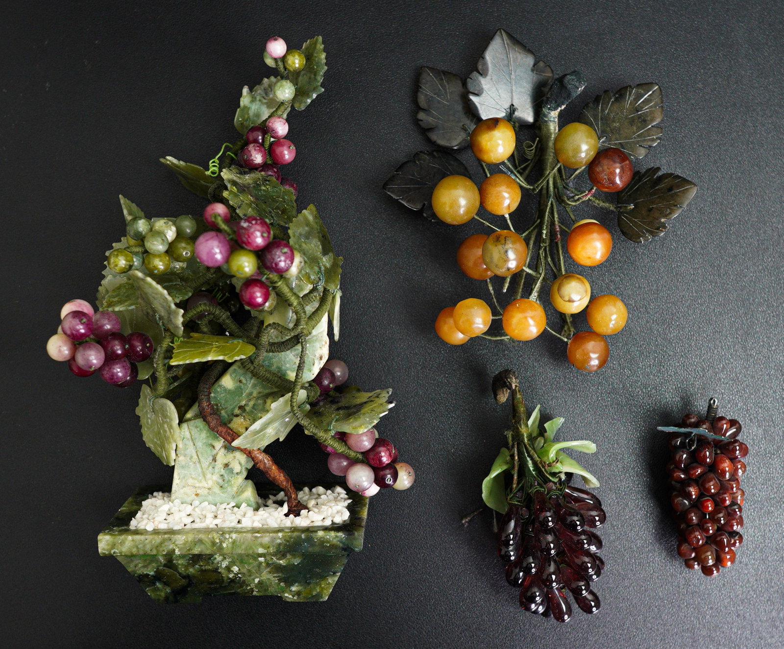 A Chinese 20th century jade and semi-precious stone vine in a pot and three bunches of grapes (1 of 11)