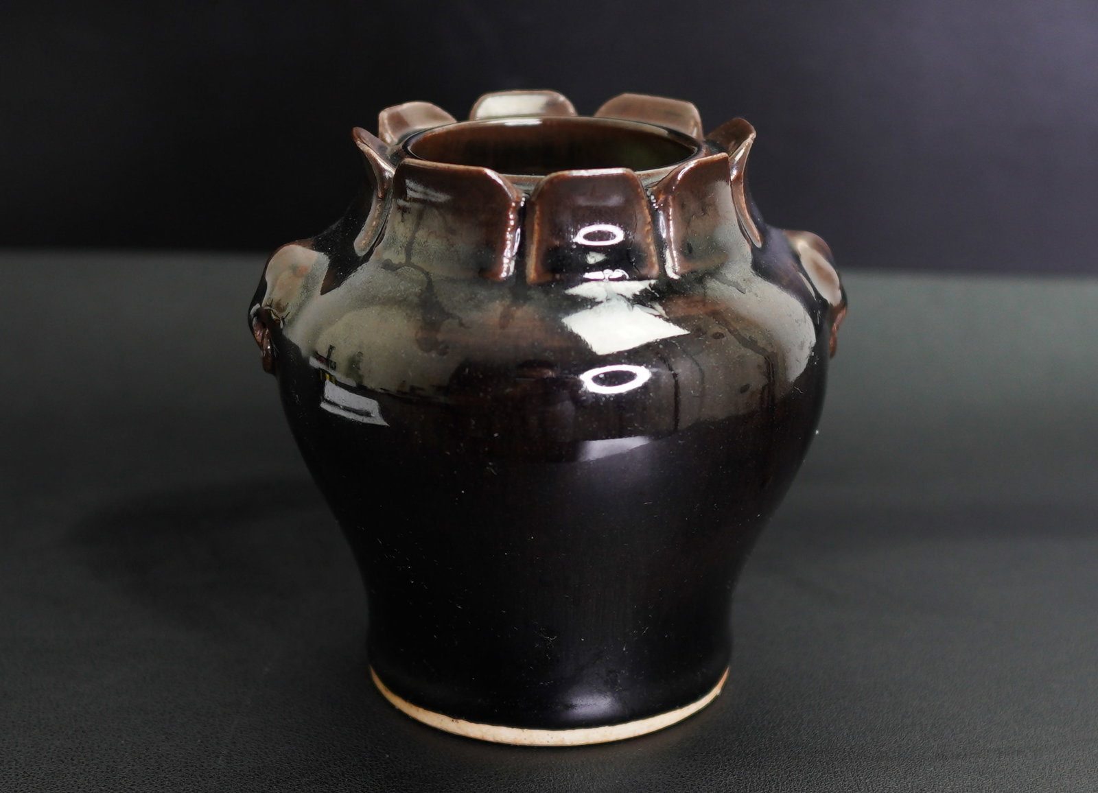 A CHINESE BROWN-GLAZED FOLIATE JAR, 19th century (1 of 8)