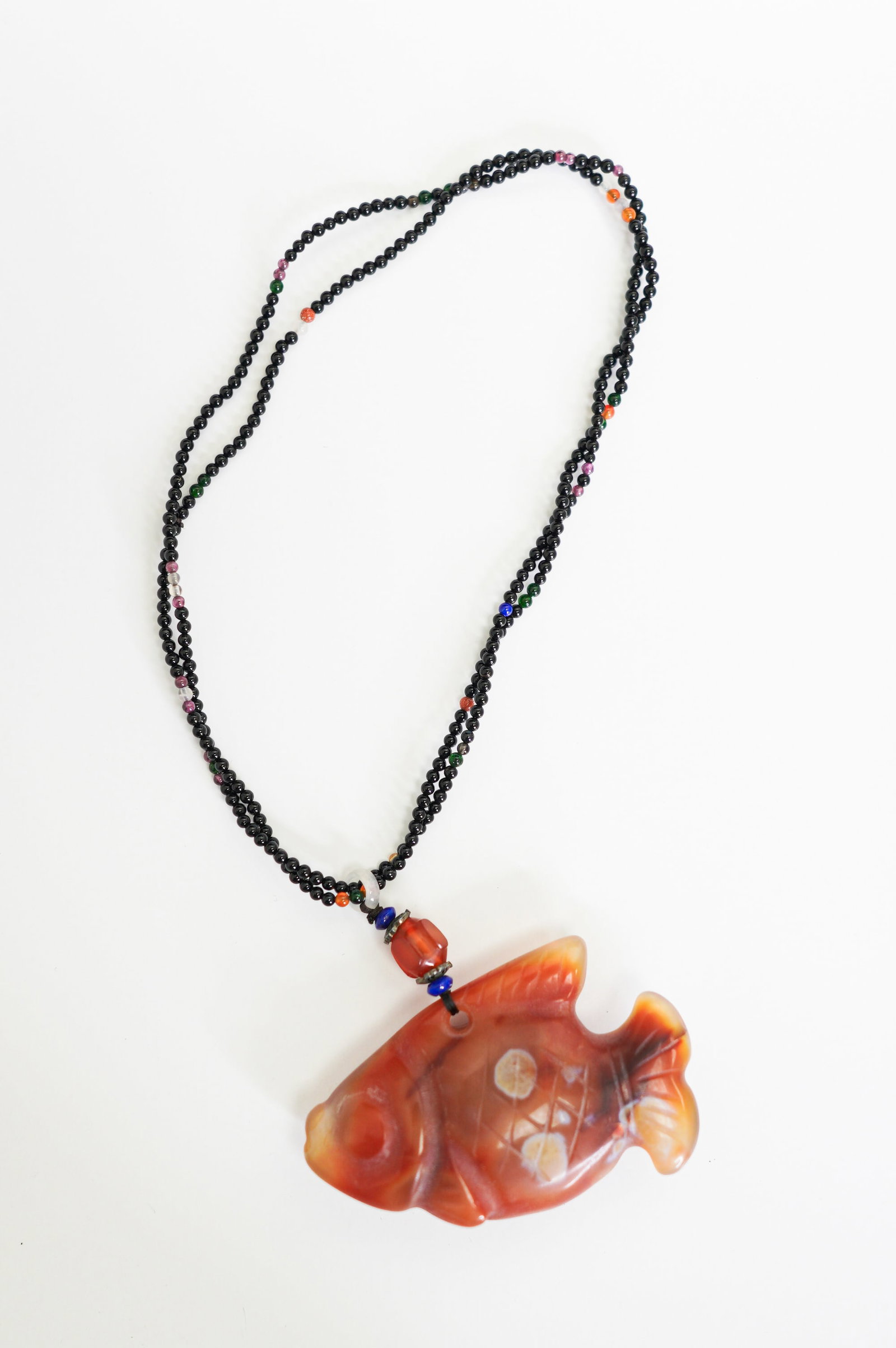 A CHINESE RED AGATE CARVED GOLDFISH PENDANT: Size:7" x 2 1/2" x 1". (including loop). Weight: 2 oz. Tri-State area in house truck delivery available. In house shipping with UPS will cost around $10-$15.