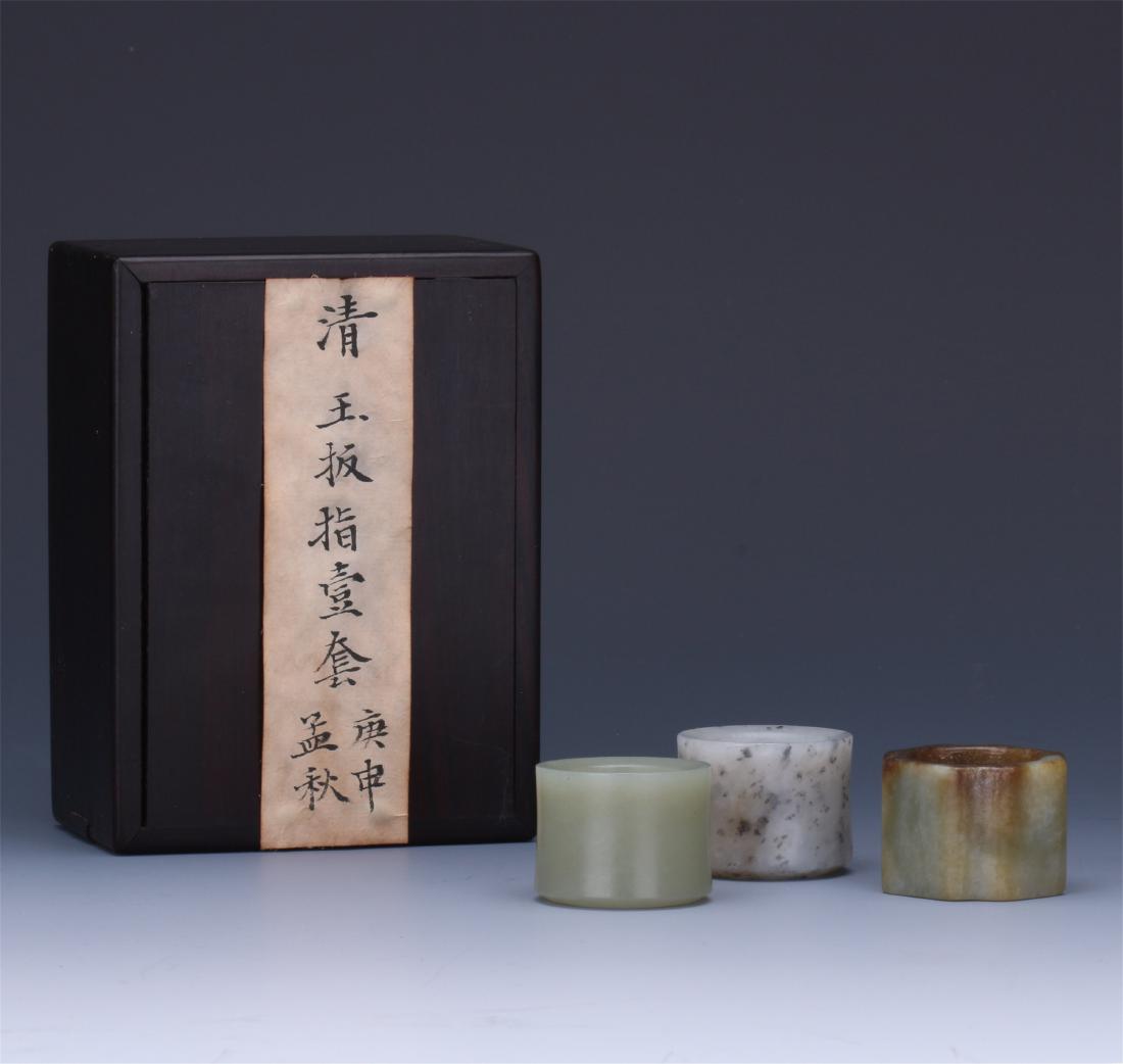 THREE CHINESE JADE ARCHER'S RINGS (1 of 10)