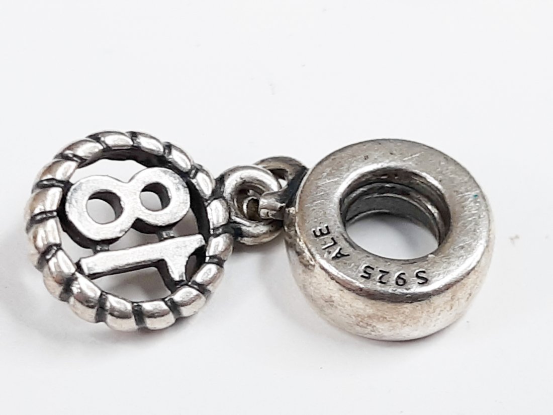 Sterling Silver Authentic Pandora 18 Charm: Sterling Silver Authentic Pandora Bracelet CharmWeight 2.3 GramsSize 1/8"Inch x 1/4"Inch