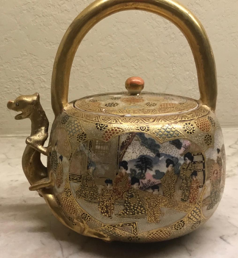 Satsuma Teapot with Dragon Spout, Meiji Period: Extremely fine Meiji Period earthenware Satsuma Teapot with a dragon spout features overall decorations of floral and geometric patterns and two cartouche, one with Court Beauties and the other with f