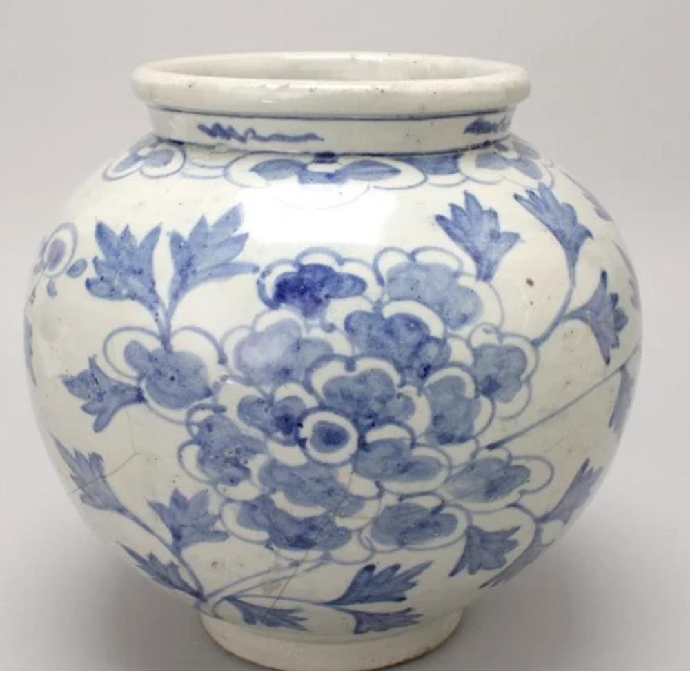 Joseon Dynasty Korean Blue White Peony Vase: A Blue and White Porcelain Jar, Of globular form with a recessed base and rising to a slightly flaring mouth rim, painted in underglaze cobalt blue of flowering peonies below two parallel bands, with 