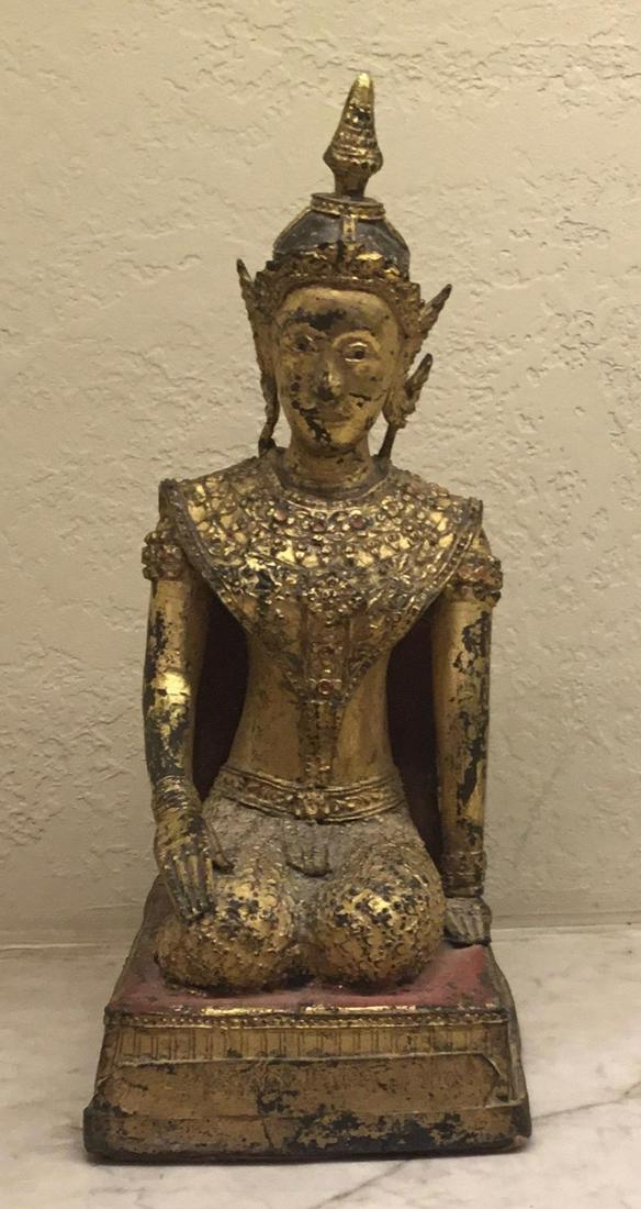 Gilded Bronze Thepphanom, Thailand, 19th Century: In royal dress, a gilded bronze female figure in an elaborate costume rests on a rectangle plinth. Cambodia, 19/20th century.