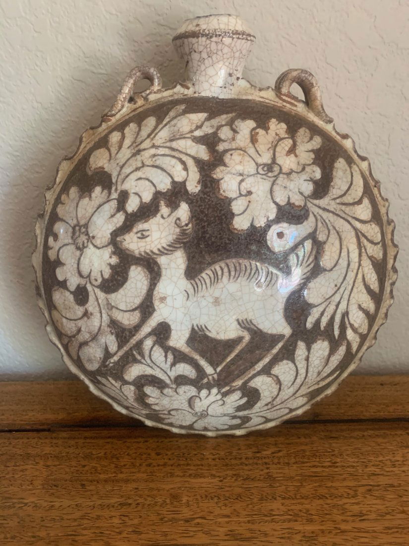 Chinese Cizhou Moon Flask: Antique Chinese brown and white Cizhou moon flask with ribbed edges features a deer among scrolling foliage. 9 inches wide x 4 inches high.